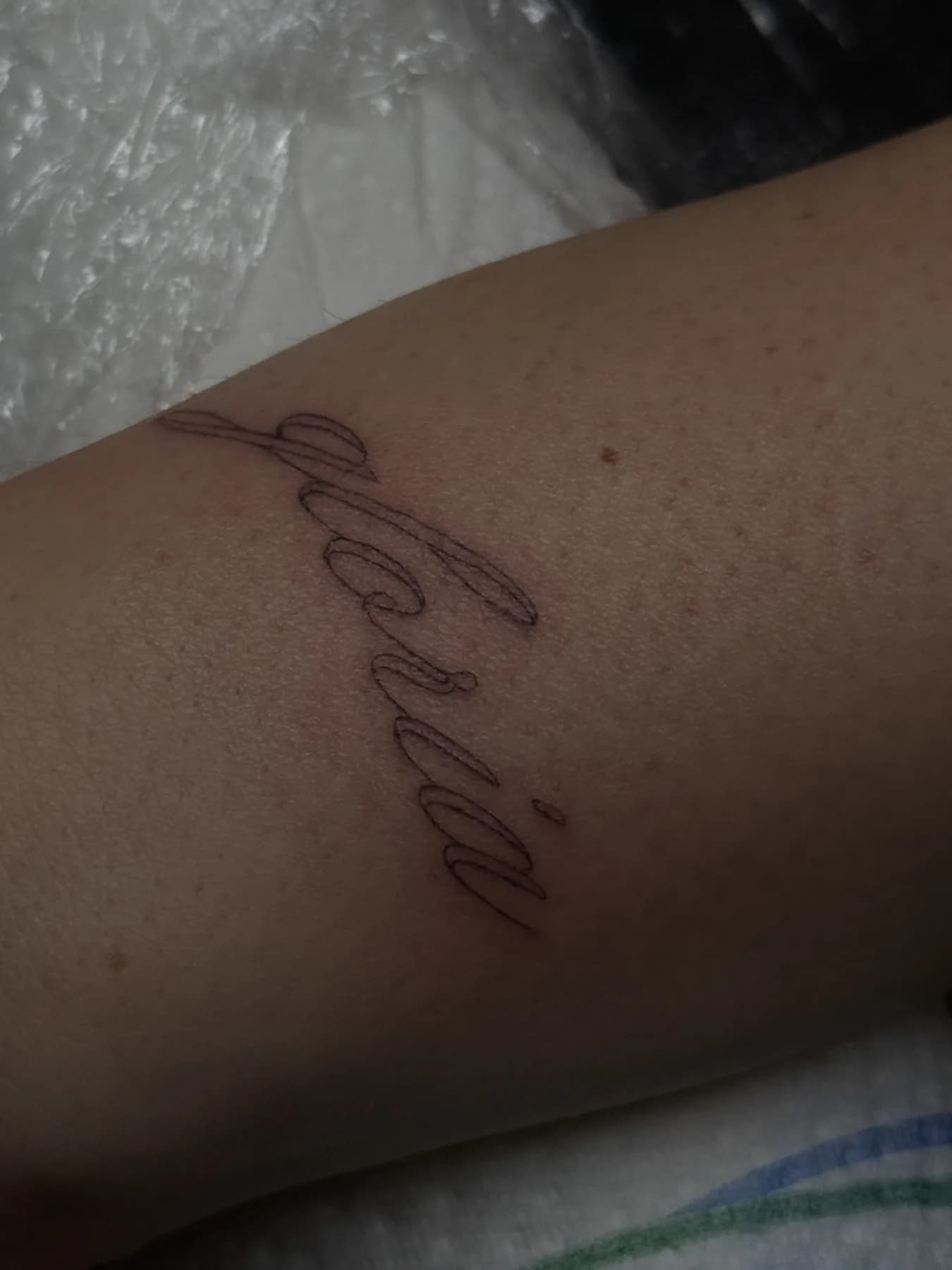 Tattoo by Nisa, script