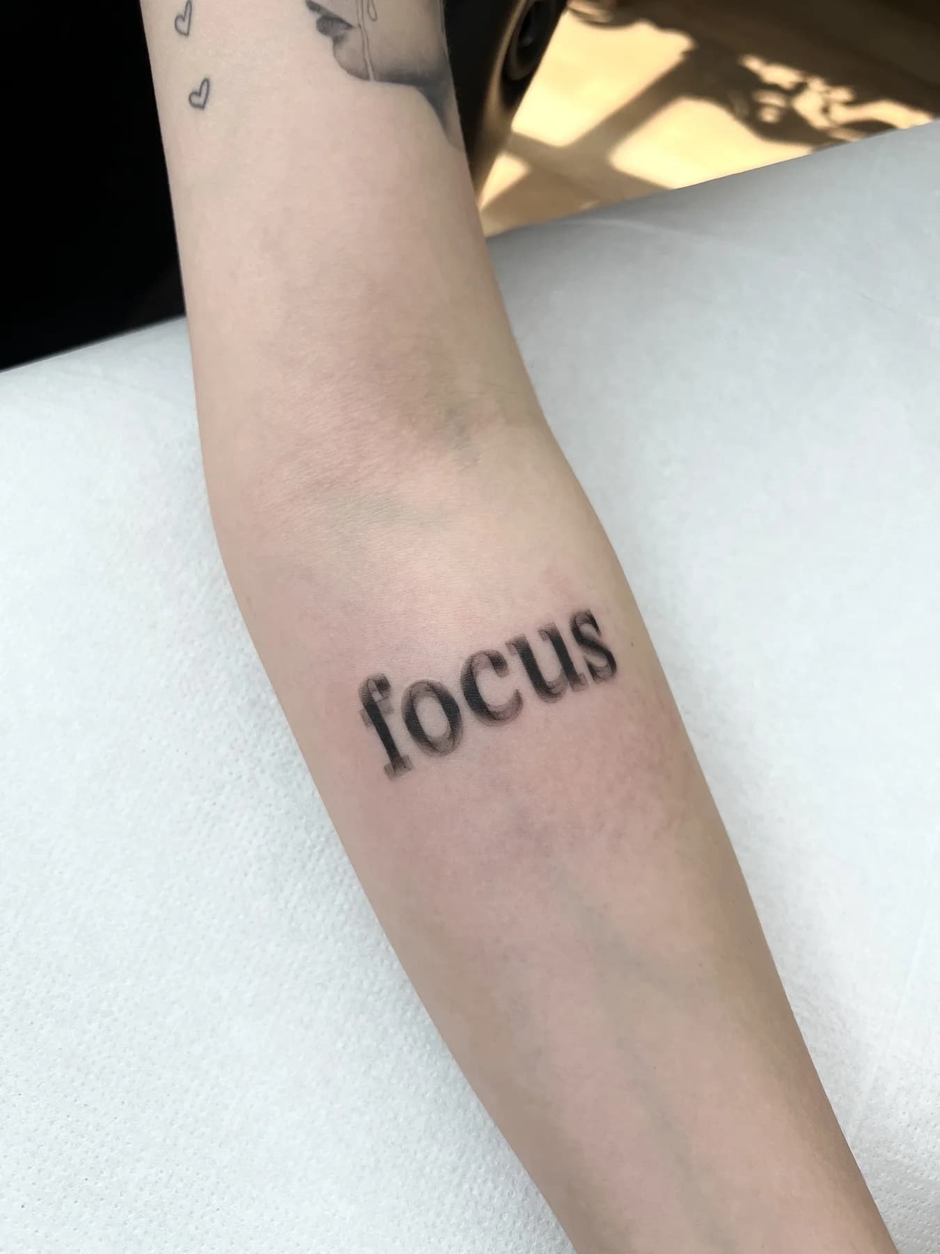 Tattoo by Nisa, script
